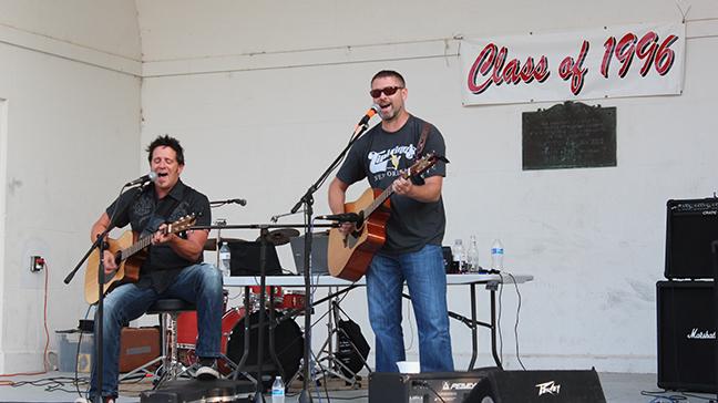 Kory Brunson and Kevin Schreiner performing at their class reunion.