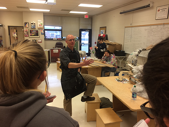 Brian Hutchinson, GBHS art instructor, describes the paper mache’ projects in progress to eighth hour journalism students on April 4.