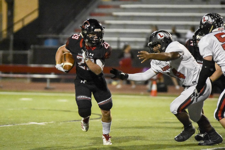 Graduated Great Bend Panther Gage Fritz escapes a tackle in 2019 Liberal game.